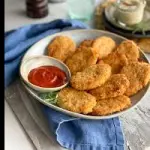 Porción de nuguets pollo