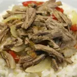 Arroz con mechada cerdo y juguito