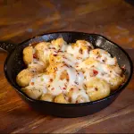 Papitas chistorra y queso