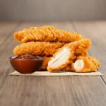 Porção Sassami empanado e frito