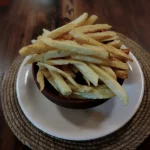 1/2 PORCIÓN DE PAPAS FRITAS