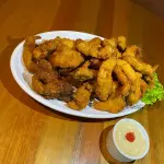 PORÇÃO DE FRANGO EMPANADO