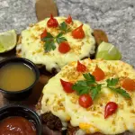 Porção de Torresmo com queijo