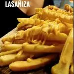 Porción de papas chedar