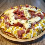 Pizza de bacon e milho