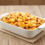 Fritas con Cheadder y Panceta