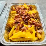 Papas cheddar y panceta
