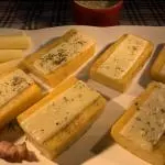 025 - Polenta Brustolada c/Queijo 1/2 porção