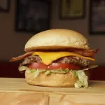 TOM B. BACON