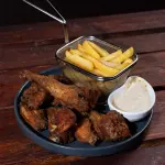 Wings con salsa de ajo y parmesano