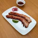 PORÇÃO DE BACON EM CUBOS