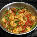 Wok de pasta con langostinos
