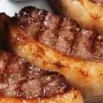 PICANHA BOVINA GRELHADA E ALHO FRITO