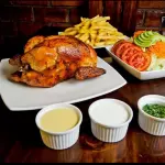 1 pollo + papas + ensalada y cremas
