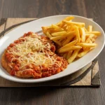 Parmegiana de Frango Noite( Fritas)