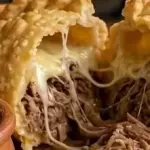 CARNE MECHADA QUESO