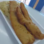 Milanesa pescado al plato con guarni