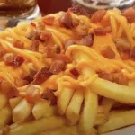Batata media cheddar/bacon
