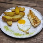 Pollo con papas asadas