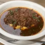 Dorado ahogado con queso
