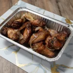 Ailes de poulet frites aux oignons