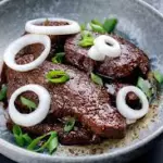Bisteck Encebollado
