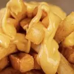 Porción de Papas Fritas con cheddar