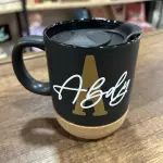 Taza negra con tapa