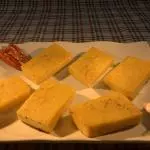 024 - Polenta Brustolada s/Queijo 1/2  porção