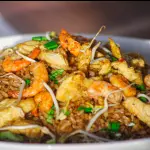 Arroz con pollo y camarón