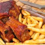 Porción de papas con Costilla