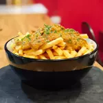 Porcion papas cheeddar carne
