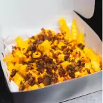 Papas con cheddar & Bacon