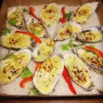 12 Ostras gratinadas.